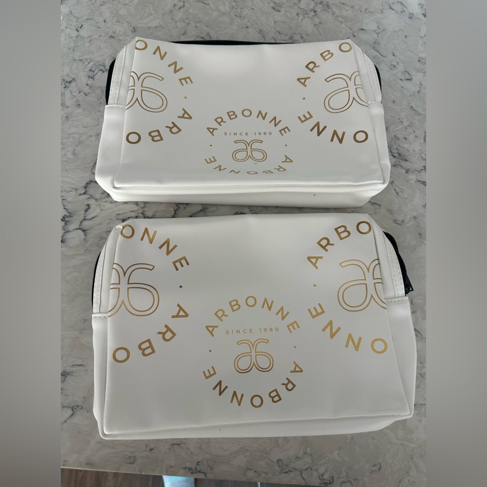 Arbonne White and Gold Cosmetic Bags with Elegant Design set of 2 brand new